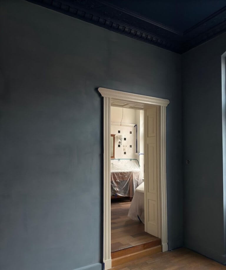 Interior wall painted with limewash showing rustic texture and matte patina