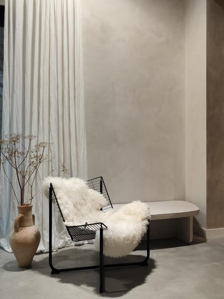 Different wall surfaces finished with limewash, white wash, and German Schmear techniques